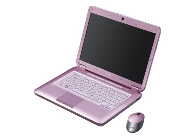 Różowy laptop.
